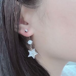 Dangle single star earring